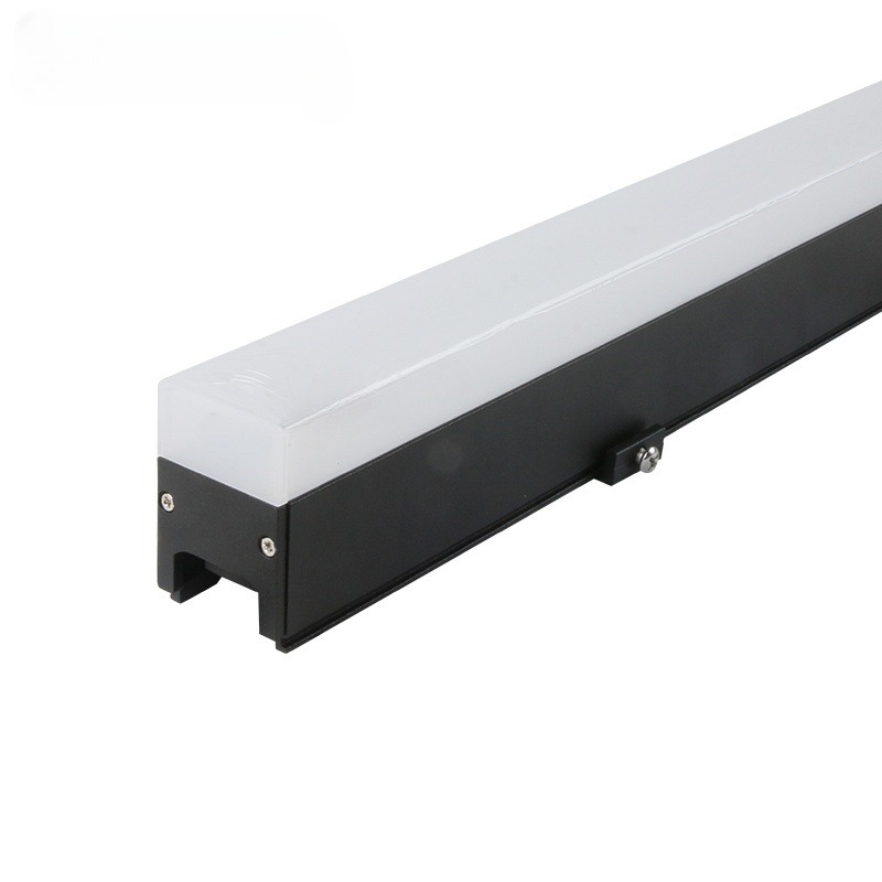 Sleek linear LED lights highlight architectural details on a glass facade.